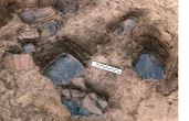 Grooved Ware pots at base of Neolithic pit, Betchworth
